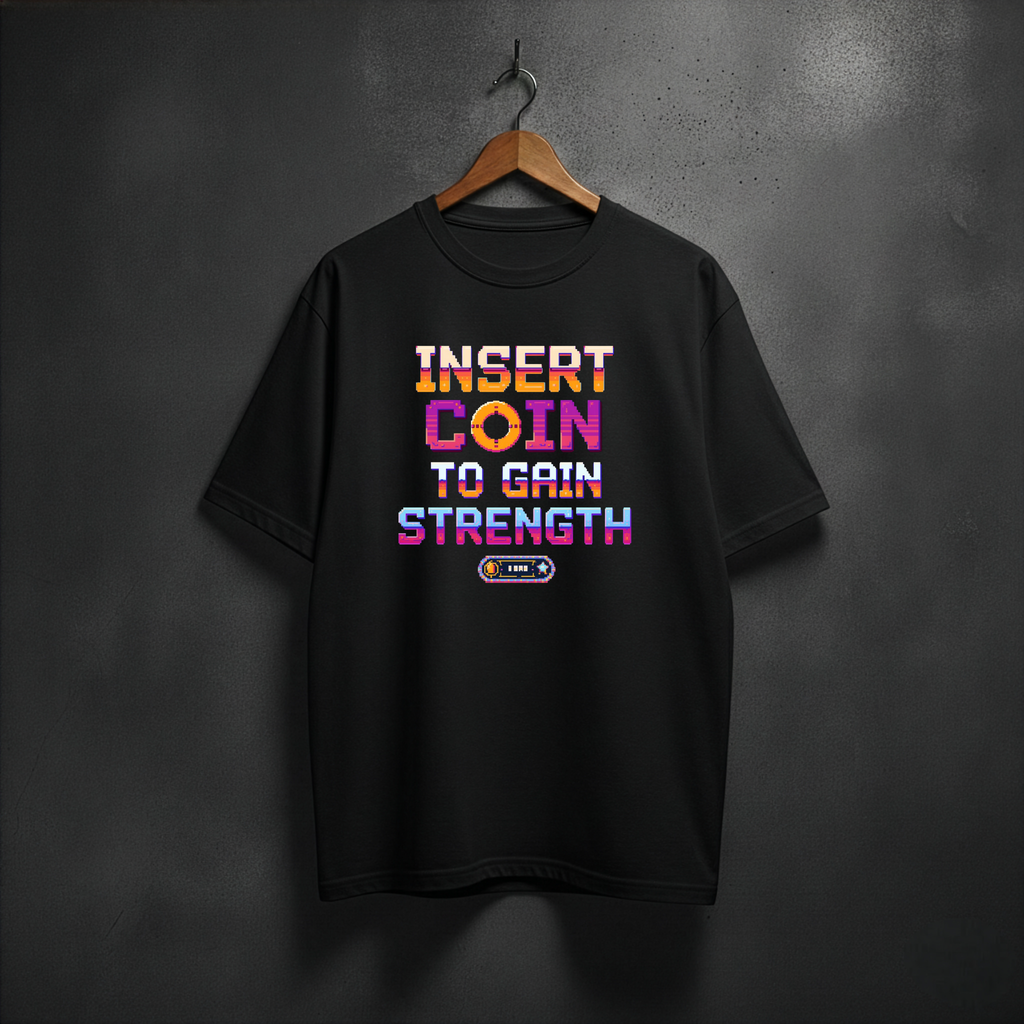 Black T-shirt with arcade style text INSERT COIN TO GAIN STRENGHT on the fron 