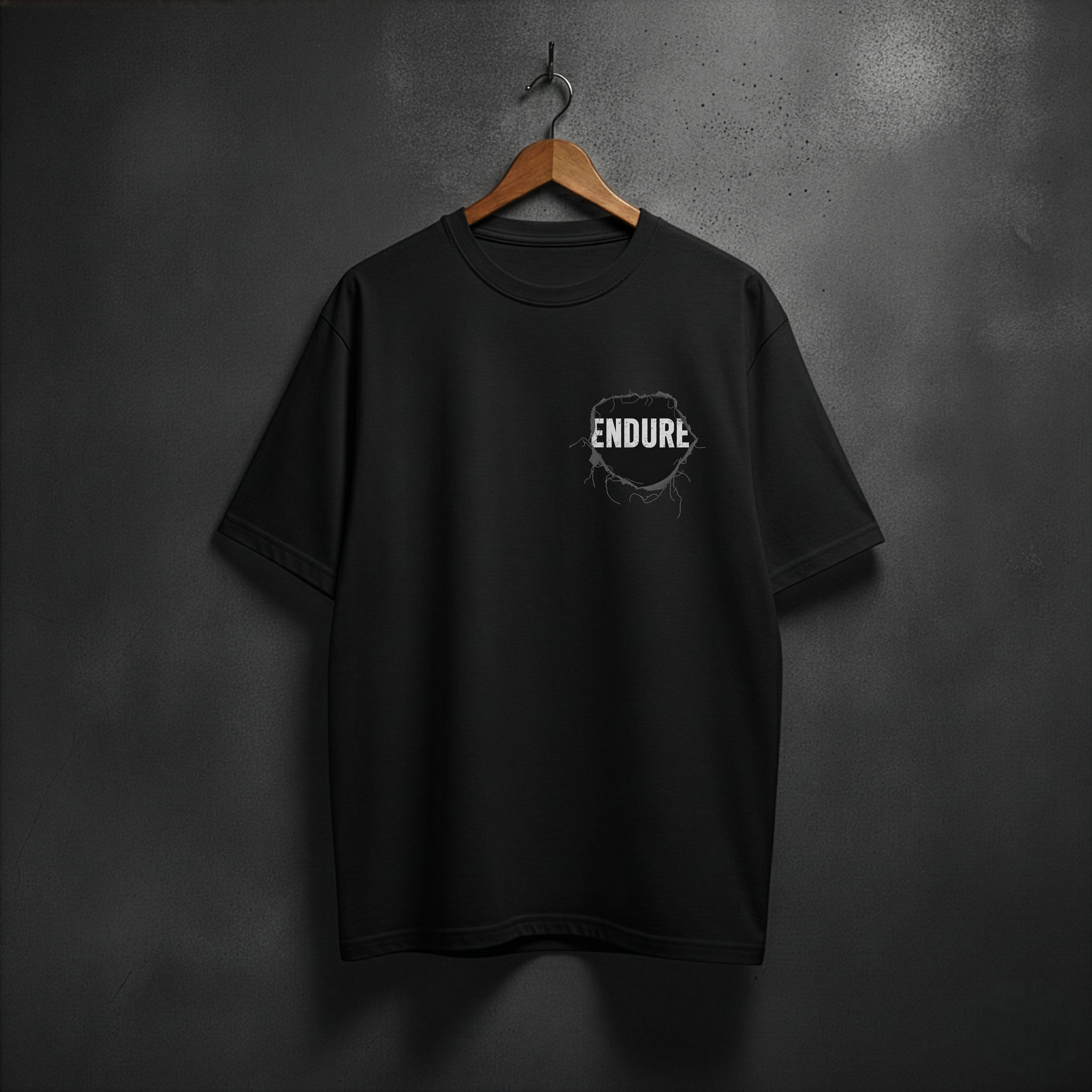 Black t-shirt with 'ENDURE' patch on the left side chest