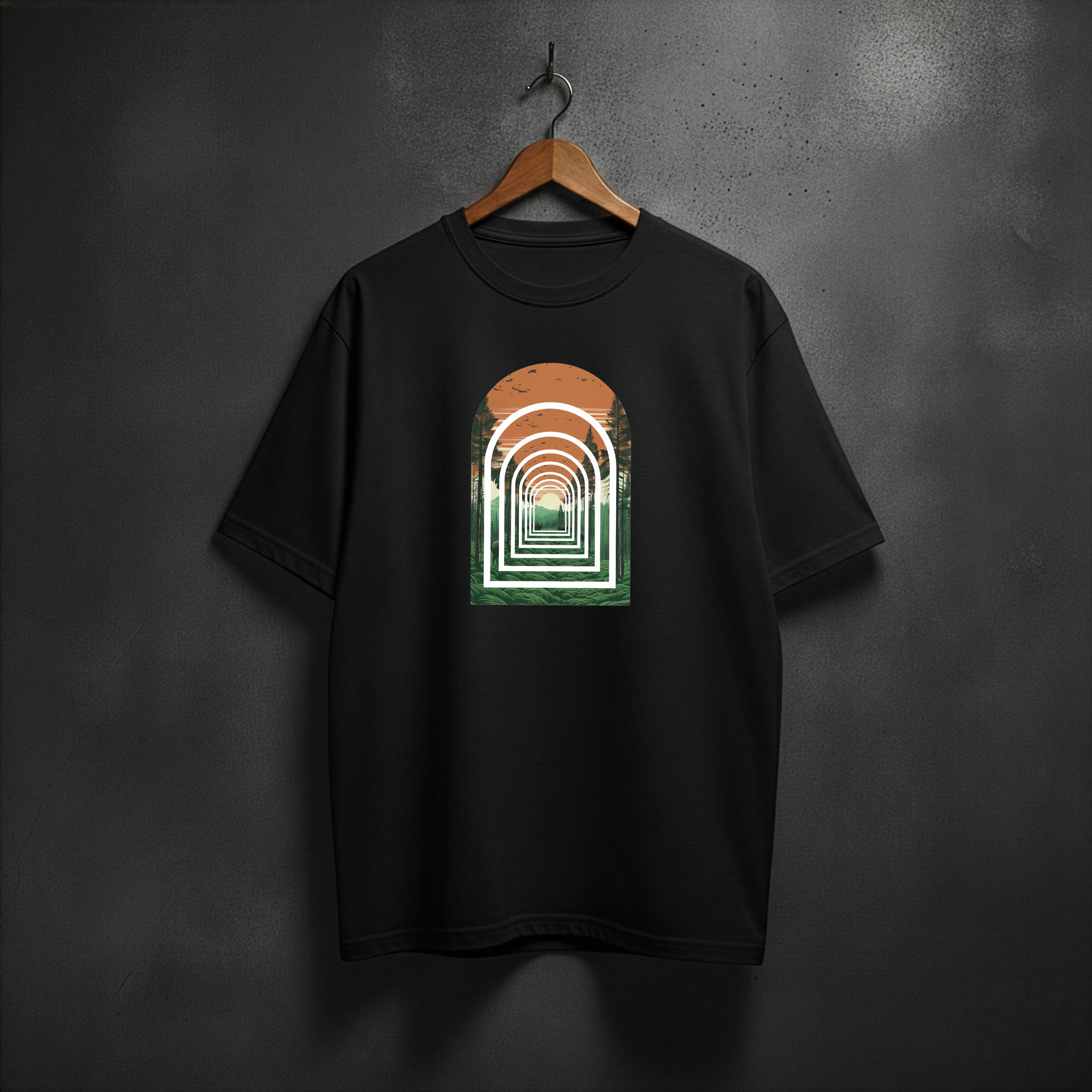 Black t-shirt with a graphic design of forest arch on the front